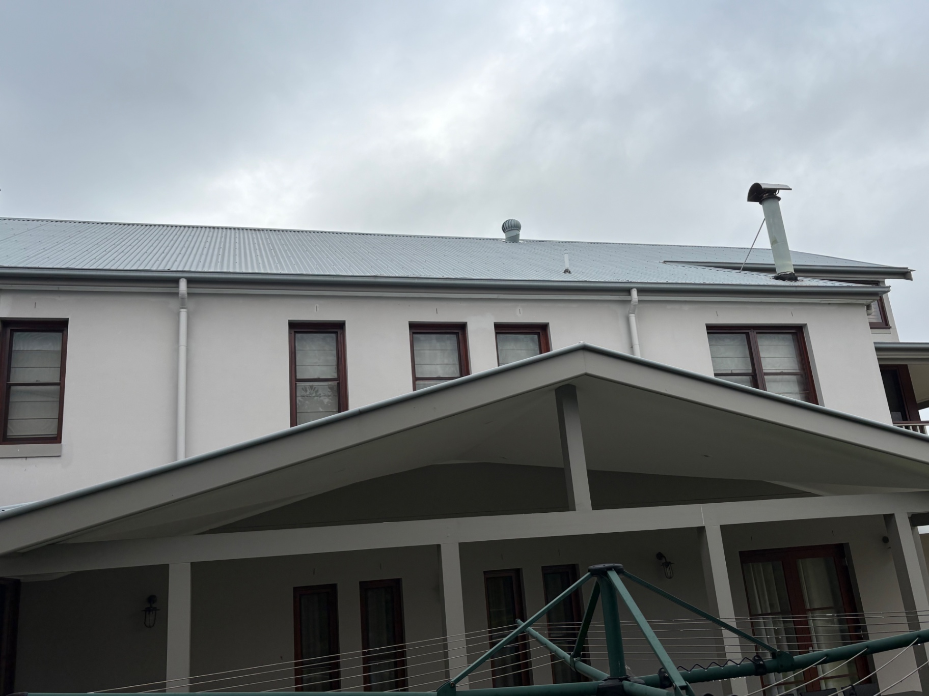 Rear elevation with upper windows above the covered patio